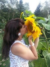 Close-up of woman holding flower