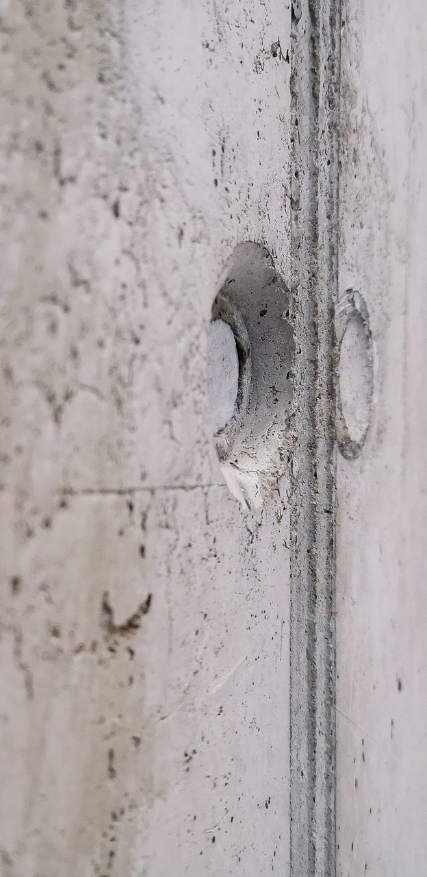 no people, close-up, full frame, metal, day, backgrounds, wall - building feature, door, architecture, selective focus, pattern, outdoors, old, entrance, weathered, built structure, white color, security, connection, silver colored