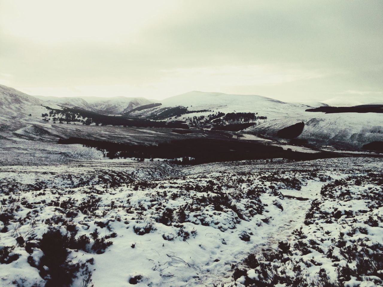 snow, winter, mountain, cold temperature, tranquil scene, landscape, sky, tranquility, mountain range, weather, scenics, season, nature, beauty in nature, non-urban scene, cloud - sky, snowcapped mountain, covering, remote, field