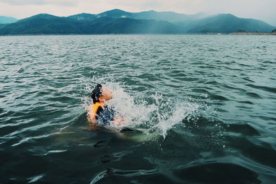 Man swimming in sea