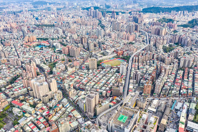 High angle view of city buildings against sky