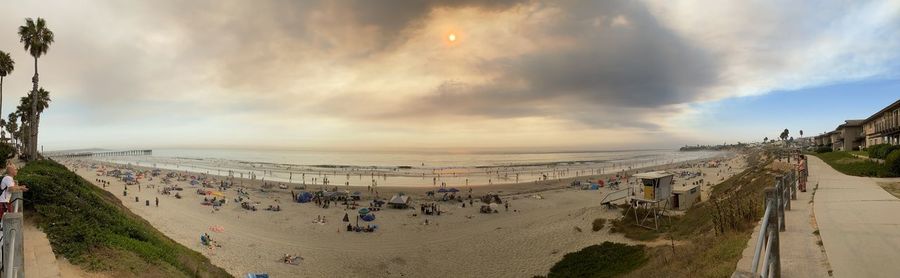 High angle view of people on beach against sky