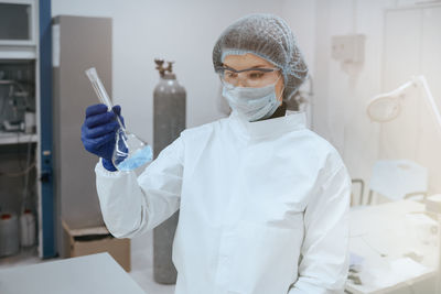 Portrait of doctor holding syringe