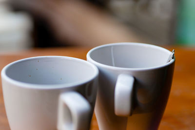 Close-up of coffee cup on table