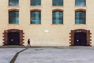 Woman walking in building