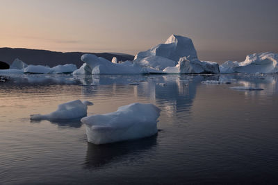 Scenic view of frozen lake against sky during winter