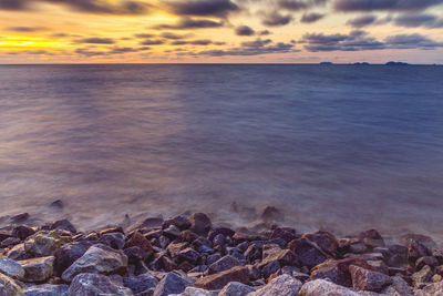 Scenic view of sea against sky during sunset