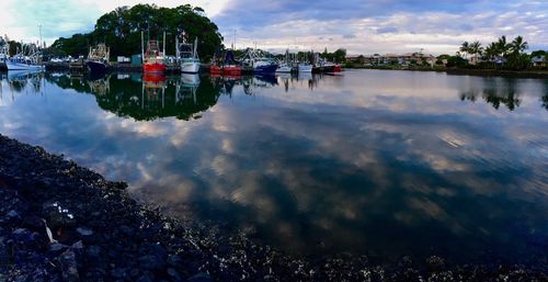Scenic view of lake against cloudy sky