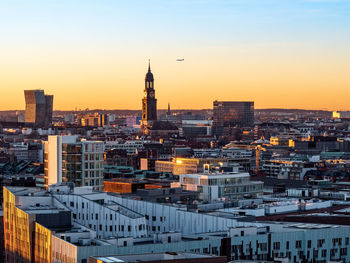 High angle view of city buildings during sunset