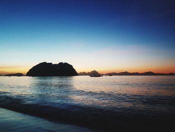 Scenic view of sea against clear sky during sunset