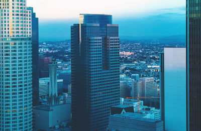 Modern buildings in city against sky