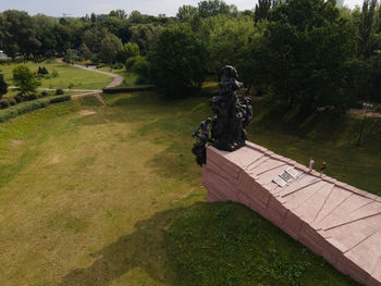 Statue against trees in park