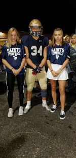 Full length portrait of siblings standing