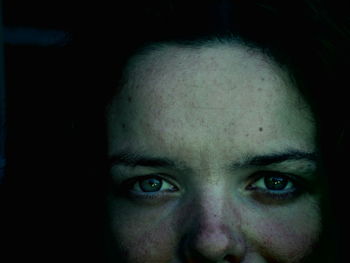 Close-up portrait of woman with freckle