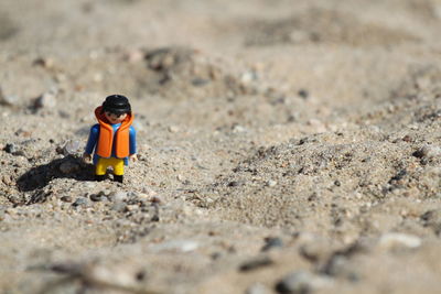 High angle view of child on sand