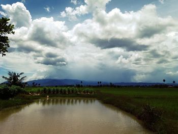 Scenic view of sea against cloudy sky