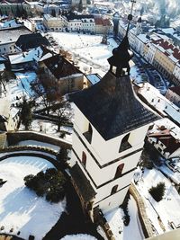 High angle view of snow covered roof and buildings