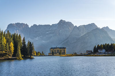 Scenic view of lake and mountains against sky