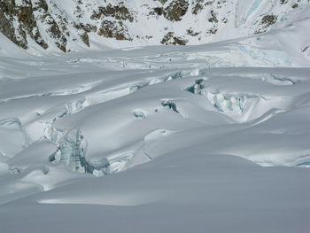 Crevasses in ice and snow on a glacier in the alaska range mountains