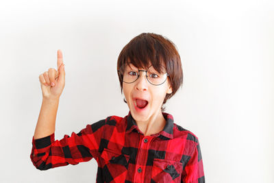 Portrait of mid adult man against white background