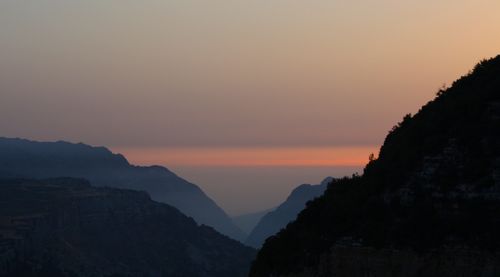 Scenic view of mountains at sunset