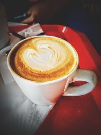 Close-up of cappuccino on table