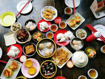 High angle view of various food served on table