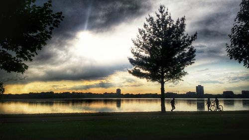 Scenic view of lake against cloudy sky