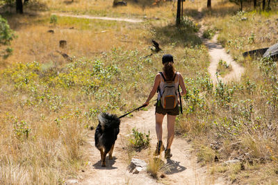 Full length of man walking with dog