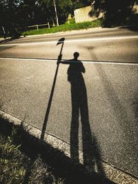 High angle view of man shadow on tree