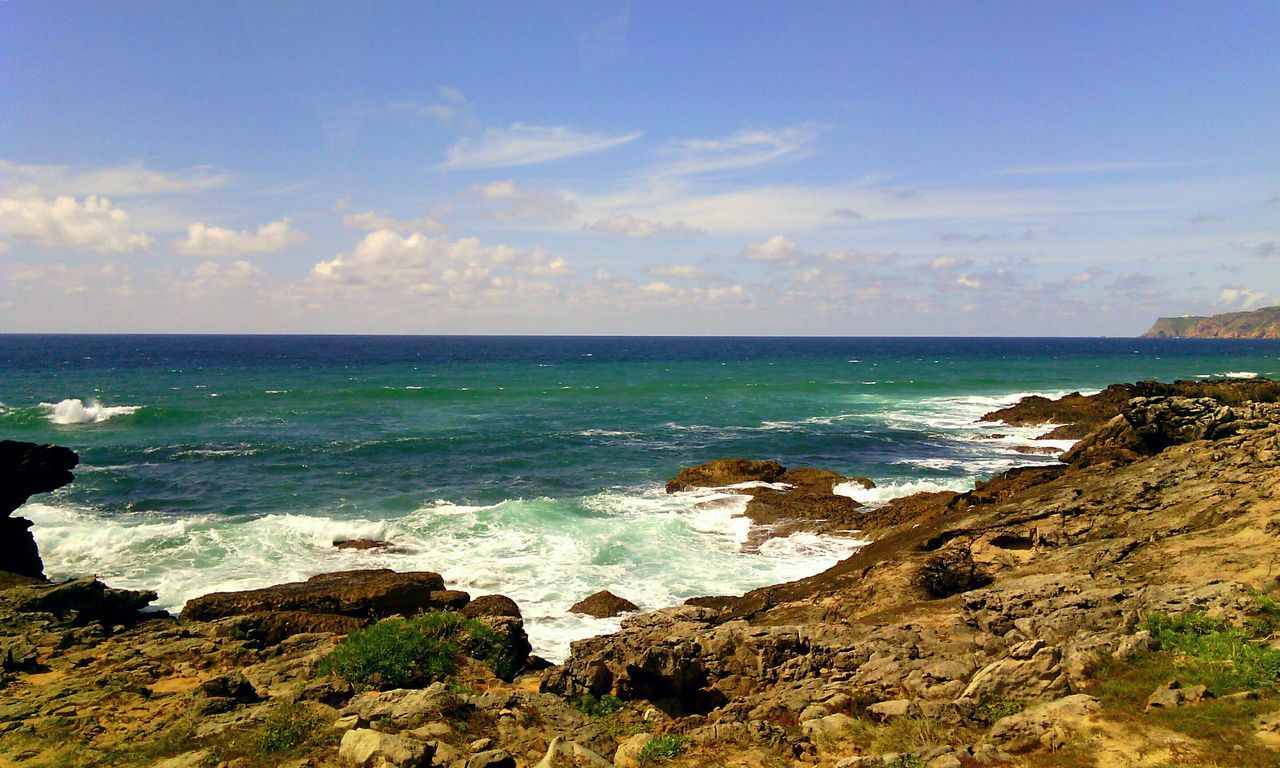 sea, horizon over water, water, sky, scenics, beach, tranquil scene, beauty in nature, shore, rock - object, tranquility, nature, blue, wave, cloud - sky, idyllic, rock formation, coastline, surf, cloud