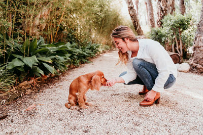 Woman with dog at park