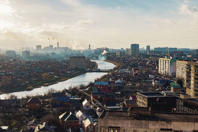 High angle view of buildings in city against sky