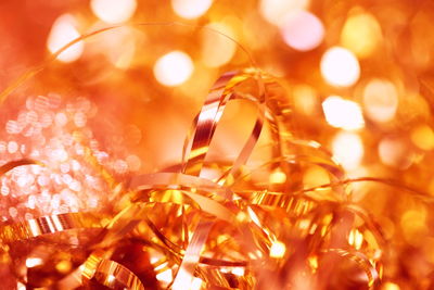 Close-up gold ribbons against defocused lights