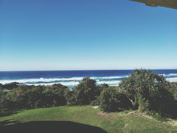 Scenic view of sea against clear blue sky