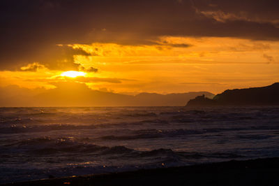 Scenic view of sea against sky during sunset