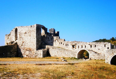 Old ruin building against blue sky