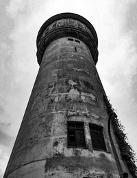 Low angle view of old tower against sky