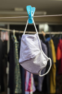 Close-up of flu mask handing outdoors