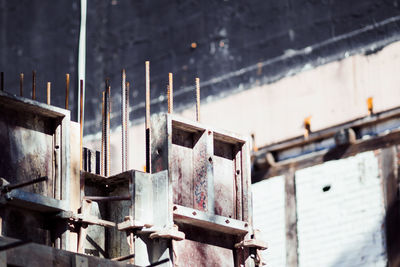 Close-up of rusty machinery in sunny day