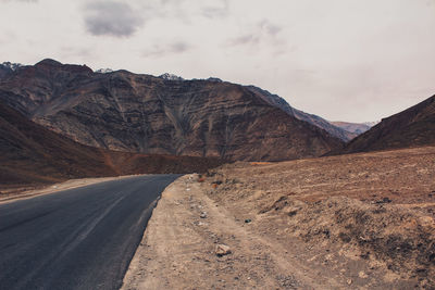 Scenic view of mountain road against sky