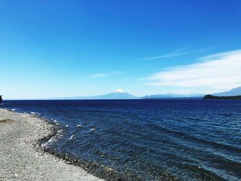 Scenic view of sea against clear blue sky