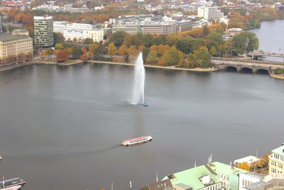 High angle view of river and cityscape against sky