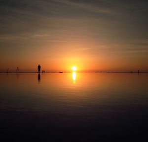 Scenic view of sea at sunset