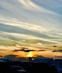 Silhouette people against sky during sunset