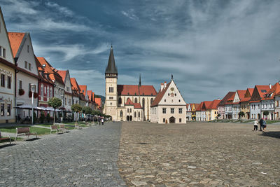 Buildings in city against sky