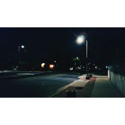 Illuminated street lights at night