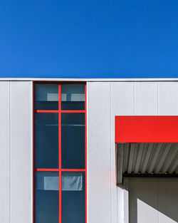 Low angle view of building against clear blue sky