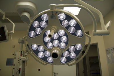 Low angle view of illuminated lighting equipment