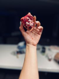 Close-up of hand holding ice cream